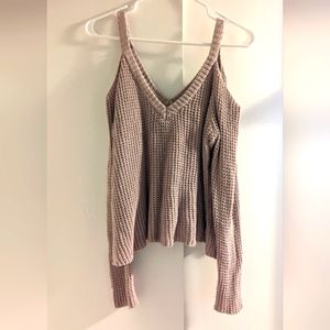 Knit sweater with shoulder cut outs